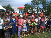 The children of the summer camp sang West Wind Brigade a song 